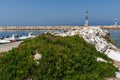 Spring flowers and pier in Skala Sotiros, Thassos island, Greece