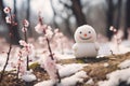 spring flowers and snowman near in snow Royalty Free Stock Photo