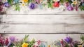 spring flowers on white rustic wooden texture table top view with copy space