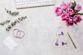 Spring flowers on workdesk at home white background top view mockup Royalty Free Stock Photo