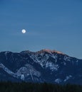 spring fool moon over mountains in british columbia canada Royalty Free Stock Photo
