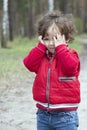 Spring in the forest distressed little girl.