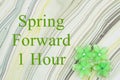 Spring forward 1 hour message with green flowers on watercolor paper Royalty Free Stock Photo