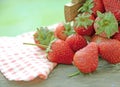 Spring fruits, strawberries in wooden bucket on a vintage wooden table Royalty Free Stock Photo