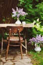 Spring garden decorations with blooming lilacs syringa bouquet