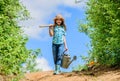 Spring gardening checklist. Little helper. Watering tools that will solve dry yard problems. Removable rose allows Royalty Free Stock Photo