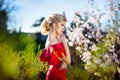 Spring girl. Beautiful model with flower wreath on her head. Close up portrait of romantic sensual lady with blue eyes Royalty Free Stock Photo