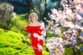 Spring girl. Beautiful model with flower wreath on her head. Close up portrait of romantic sensual lady with blue eyes Royalty Free Stock Photo