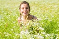 Spring Girl. Beautiful Spring Young Woman Outdoors Enjoying Nature. Smiling Young Woman in Green Grass. Spring Meadow Royalty Free Stock Photo