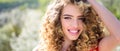 Spring girl with curly hair smiling. Beauty young woman enjoying nature in spring garden. Banner spring design Royalty Free Stock Photo