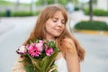 Spring girl portrait. Woman near blossom spring park. Woman on spring blooming tree. Beautiful young woman in springs Royalty Free Stock Photo