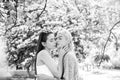 Spring girls. Lesbian couple kissing. Beautiful spring sexy girl with sakura flowers. Sensual kiss. Girlfriends love. Royalty Free Stock Photo