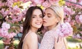 Spring girls. Lesbian couple kissing. Beautiful spring sexy young woman with sakura flowers. Sensual kiss. Lgbt. Royalty Free Stock Photo