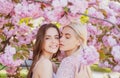 Spring girls. Lesbian couple kissing. Beautiful spring sexy young woman with sakura flowers. Sensual kiss. Lgbt. Royalty Free Stock Photo