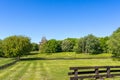 Spring green landscape with wooden temple and fence