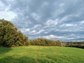 occitanie spring green meadow under heavy gray clouds