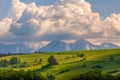 Spring green mountain landscape with meadows and rocky peaks. Royalty Free Stock Photo