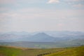 Altai mountain range on the horizon in colors, as in the paintings of Roerich