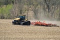 CAT Challenger MT875C tractor pulling a .KUHN Krause Excelerator 8005 disc cultivator for spring planting Royalty Free Stock Photo