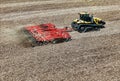 CAT Challenger MT875C tractor pulling a .KUHN Krause Excelerator 8005 disc cultivator for spring planting Royalty Free Stock Photo