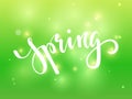 Spring. Hand drawn calligraphy and brush pen lettering on green blured background with bokeh. design for holiday greeting card, in