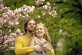 Spring. happy couple in love in spring magnolia flowers Royalty Free Stock Photo