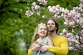 Spring. happy couple in love in spring magnolia flowers Royalty Free Stock Photo