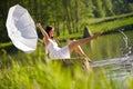 Spring - Happy romantic woman sitting by lake Royalty Free Stock Photo