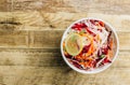 Spring healthy vegan salad with raw beet, carrot and cabbage in white bowls. Alkaline Diet concept. Top view. Flat lay