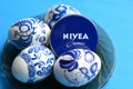 Eggs easter and nivea cream blue background