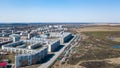 Spring landscape from a aerial view of the small city of Leninsk Kuznetsk, of the streets with a road, tall buildings, houses with Royalty Free Stock Photo