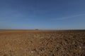 Spring landscape with arable land and blue sky Royalty Free Stock Photo