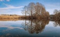 Spring landscape in early spring. River, trees without leaves Royalty Free Stock Photo