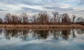 Spring artistic scenery with river,trees,reflections and clouds Royalty Free Stock Photo