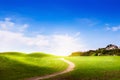 Spring landscape with green grass and clouds