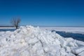 spring landscape from the lake shore, white ice cubes, blue sky, Lake Burtnieki, Latvia. Royalty Free Stock Photo