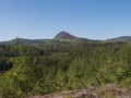 Spring landscape in Lusatian Mountains with view point hill Klic or Kleis, fresh deciduous and spruce tree forest. Blue Royalty Free Stock Photo