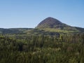 Spring landscape in Lusatian Mountains with view point hill Klic or Kleis, fresh deciduous and spruce tree forest. Blue Royalty Free Stock Photo