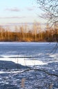 Spring landscape with melting ice on the lake on a clear day Royalty Free Stock Photo