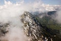 Spring landscape with the mountain peaks covered with snow and clouds Royalty Free Stock Photo