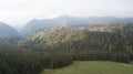 Spring landscape with the mountain peaks covered with snow and clouds Royalty Free Stock Photo