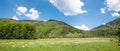 Spring landscape Rottachtal valley with green pasture and wooded hills, upper bavaria Royalty Free Stock Photo