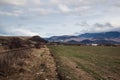 Spring landscape with snowy mountains near Brasov, Transylvania, Romania. Royalty Free Stock Photo