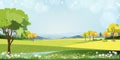 Spring landscape in Sunny day village with meadow on hills with blue sky, Panoramic countryside of green field, mountains and Royalty Free Stock Photo