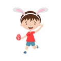 Spring laughing running boy with bunny ears with Easter egg.
