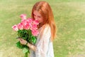 Romantic woman with bouquet of flowers