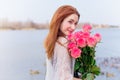 Romantic woman with bouquet of flowers