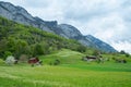 Spring meadows and fields landscape with cottage houses in Switzerland Royalty Free Stock Photo