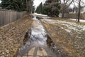 Spring melted snow water flood on sunked concrete