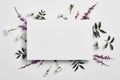 Spring minimal concept. Creative flowers flat lay. White paper blank